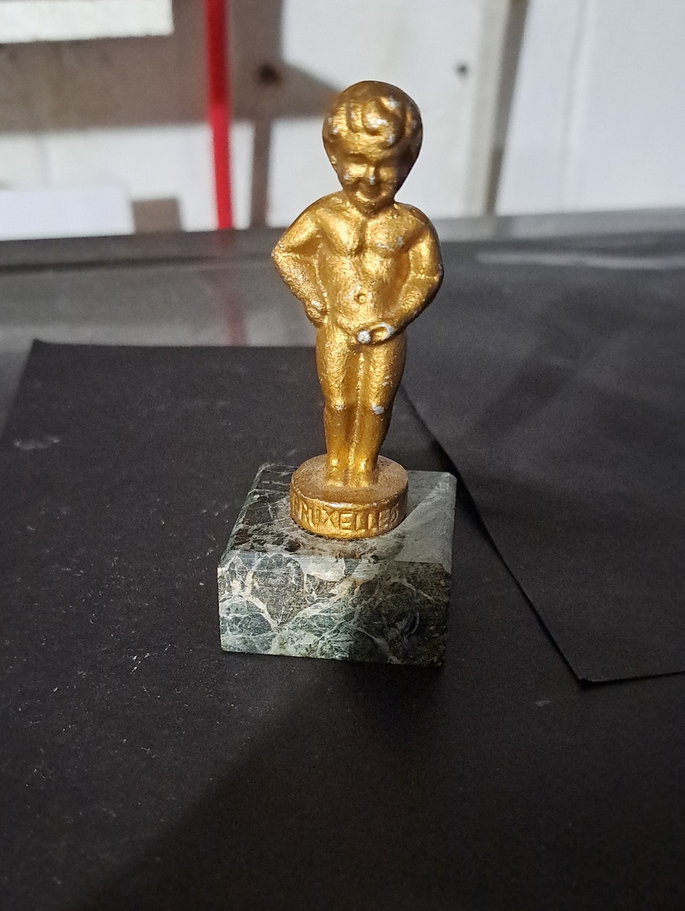 1900 Manneken Statue On Marble Bass